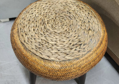 Round woven rattan stool with wooden legs