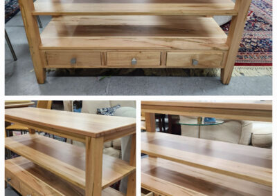Three-tier natural wood console table with drawers