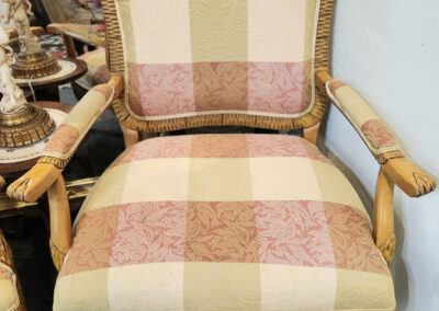 Antique cane armchair with pink plaid upholstery