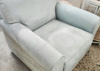 Light blue upholstered armchair in store display