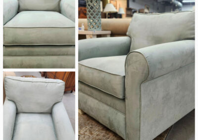 Light green upholstered armchair in showroom