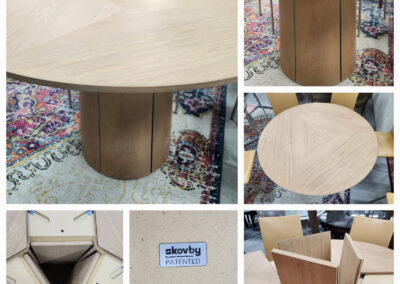 Round wooden dining table with pedestal base