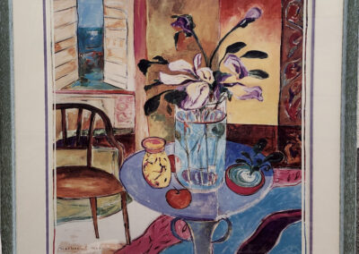 Framed colorful still life with vase and chair