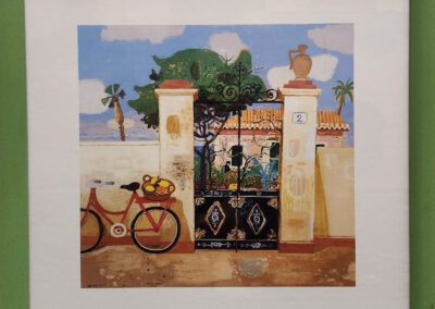 Framed painting of seaside villa gate with bicycle