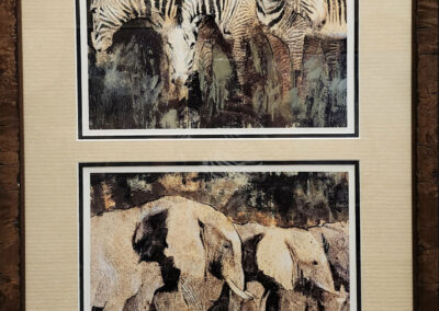 Framed artwork of zebras and elephants