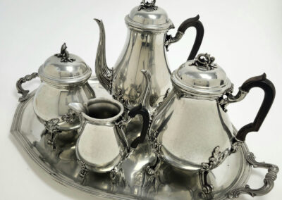 Antique silver tea set on serving tray