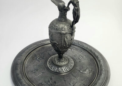 Ornate metal ewer with standing figure