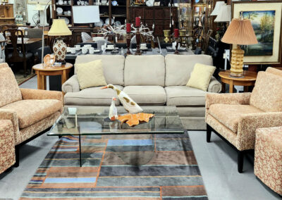 Beige living room set with glass coffee table
