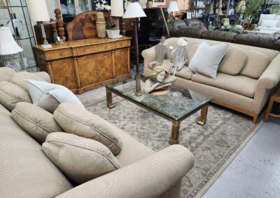 Beige sofas with glass coffee table in showroom