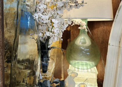 Green glass lamp with vases and flowers