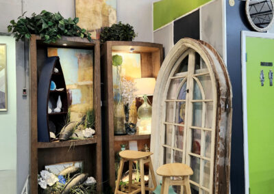 Antique shop display with stools and arched window