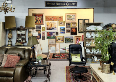 Art gallery interior filled with furniture and paintings