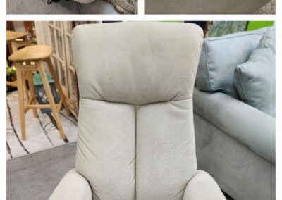 Light beige power recliner chair with controls