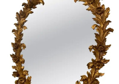 Ornate vintage gilded oval wall mirror
