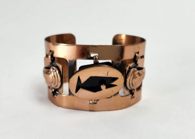 Copper cuff bracelet with fish cutout
