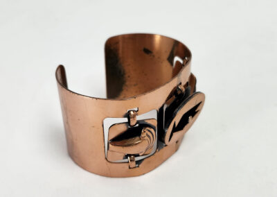 Copper cuff bracelet with decorative metal accents