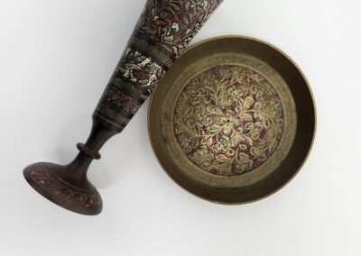 Ornate brass goblet and decorative bowl