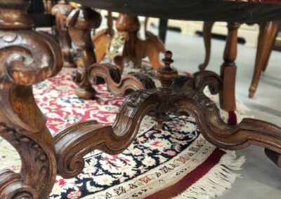 Antique carved chair legs on Persian rug