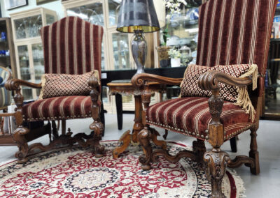 Pair of ornate red striped antique armchairs