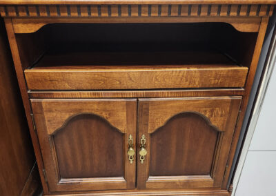 Vintage wooden cabinet with brass handles