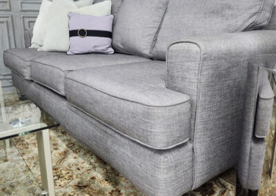Light gray sofa with decorative pillows