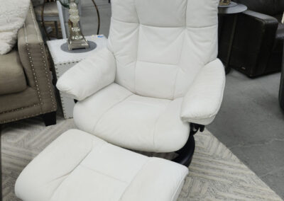 White leather recliner with matching ottoman